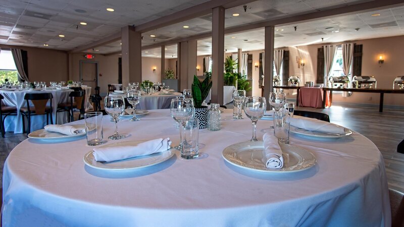 Close up view of round table set for eight in private event room