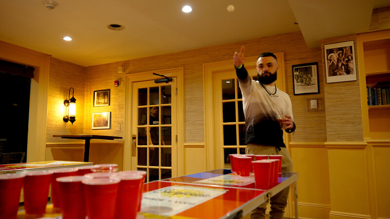 Pong player throwing ping pong ball